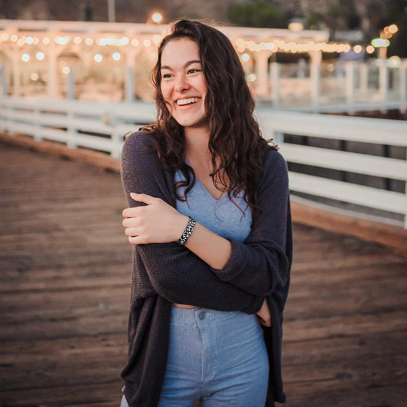 Lifestyle image of someone standing on a pier wearing Gifted