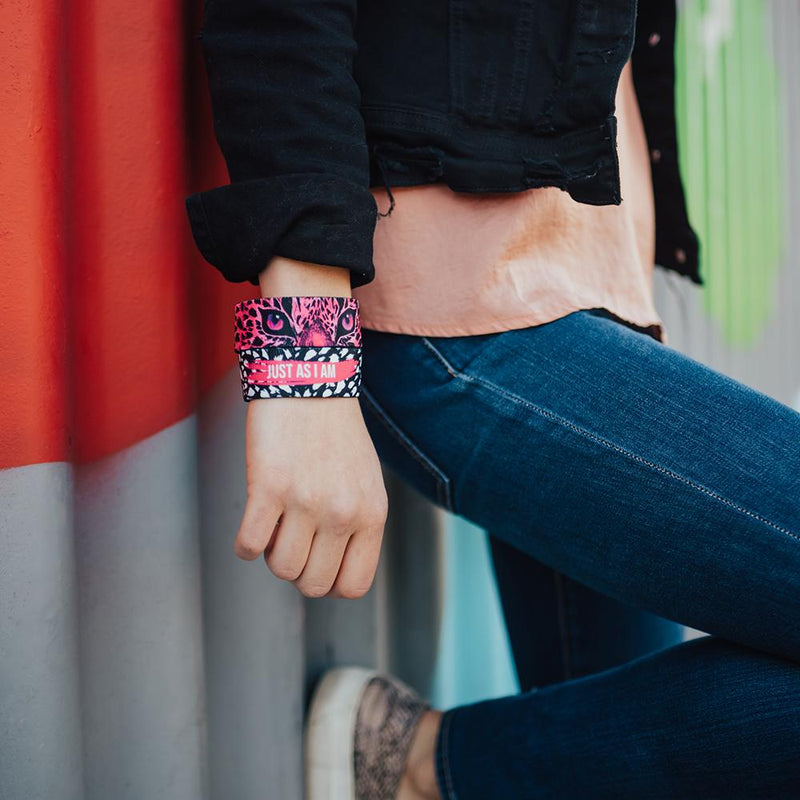 lifestyle image of a woman with her hand to her side with two Just As I Am on, both showing different the pink color variant of the front and back