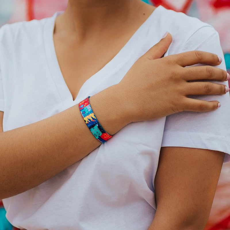 Lifestyle photo of wrist wearing live with joy showing the outside design with hand drawn geometric and abstract art