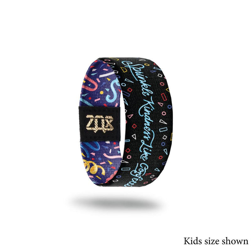 Inside Design of Sprinkle Kindness Like Confetti (kids size): black background with varying colored confetti outlines and light blue cursive text ‘Sprinkle Kindness Like Confetti’