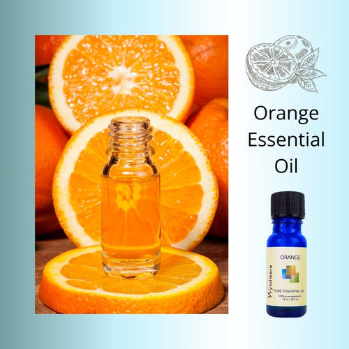 Wyndmere Orange Essential Oil 10ml cobalt blue bottle, orange slices, clear bottle of oil.