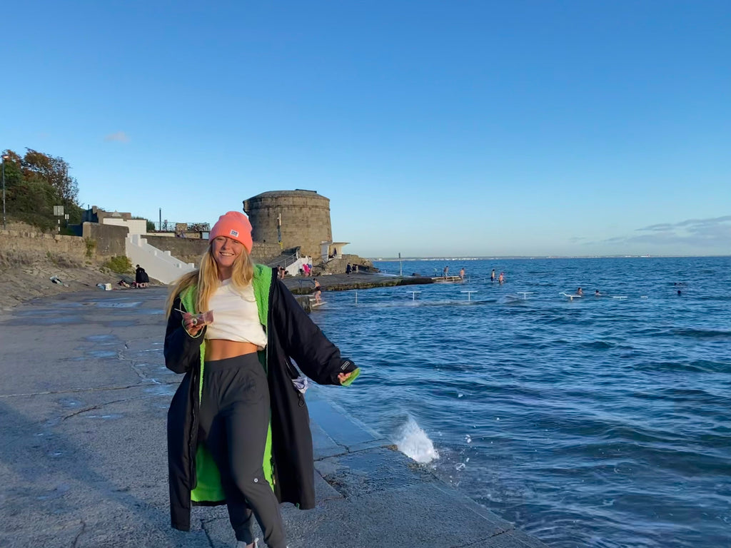 Lara Gillespie wearing a Gym+Coffee outfit at the beach.