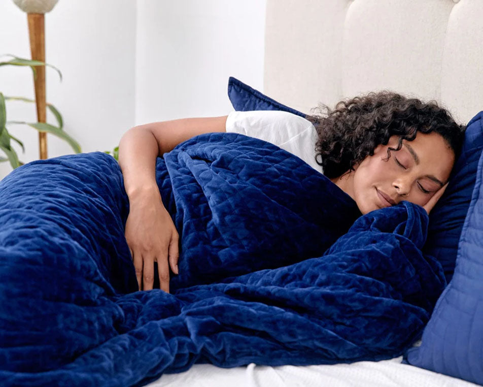 woman sleeping with blue gravity blanket