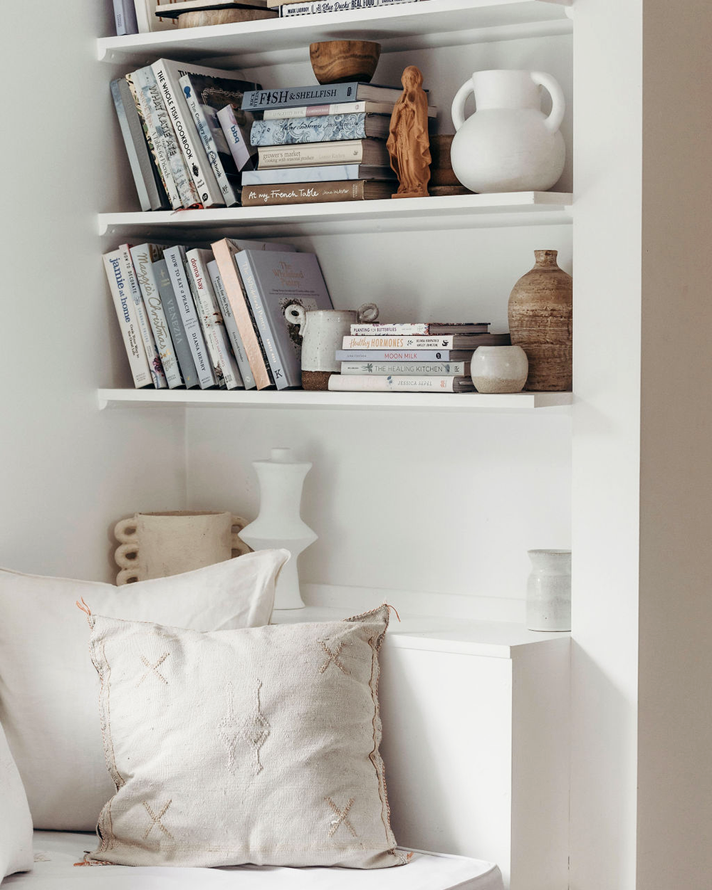 Bookshelf with sculptural pieces and meaningful objects