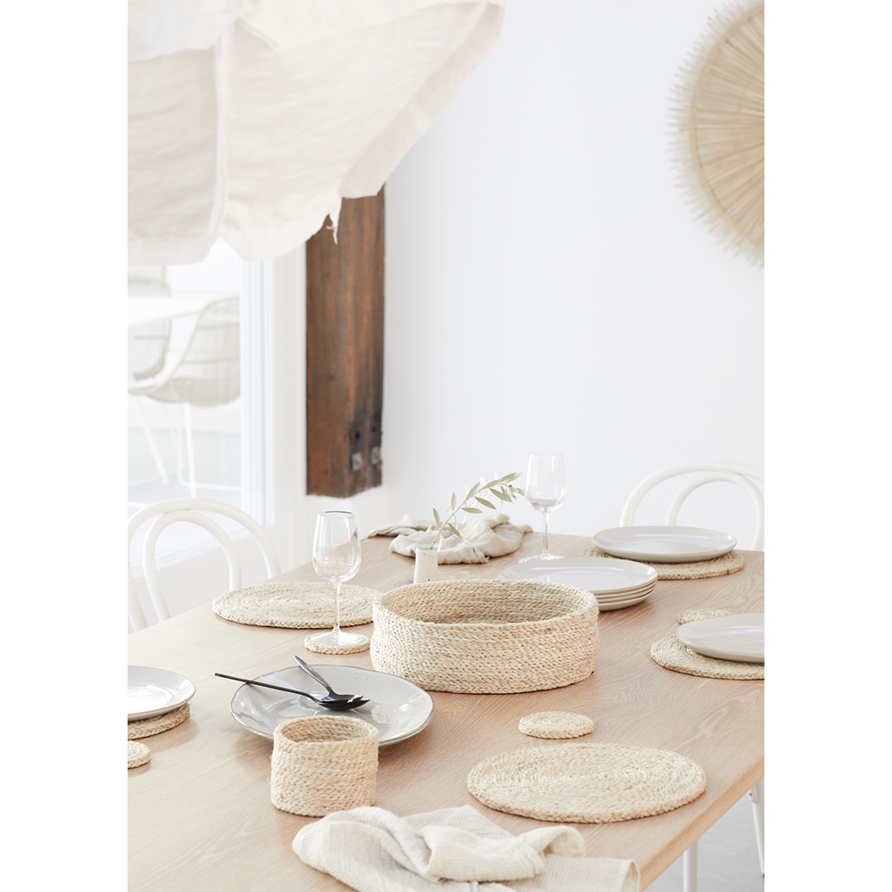 dining setting with coastal and natural tones and handwoven jute placemats