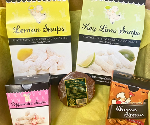 Gift box with yellow tissue paper containing 5 items; 6oz Lemon Snaps, 6oz Key Lime Snaps, 4oz Peppermint Snaps, 3.5oz Cheese Straws, 2oz Pecan Turtle