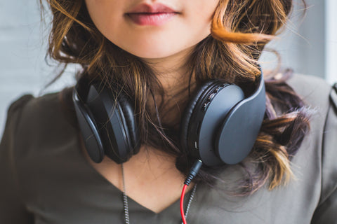 Woman headphones around neck