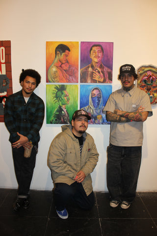 Josiah O'Balles and Friends with O'Balles' paintings