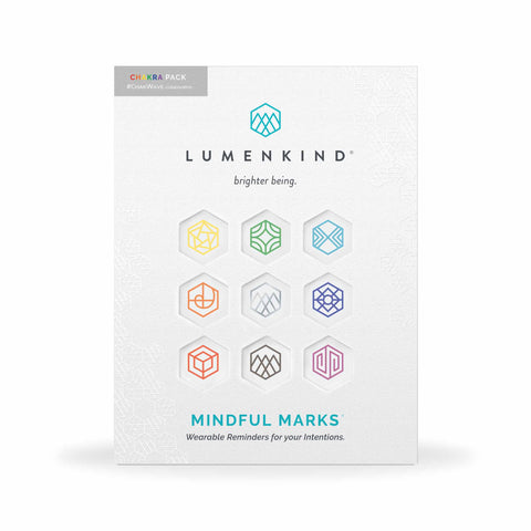 The front side of a pack of Mindful Marks — Chakra Pack, wearable reminders for your intentions.