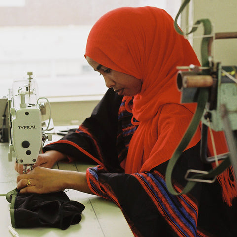 woman sewing nisa underwear 