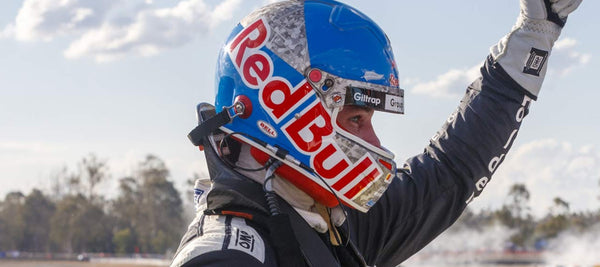 Driver Wearing a Racing Helmet and Hans Device - Fast Racer