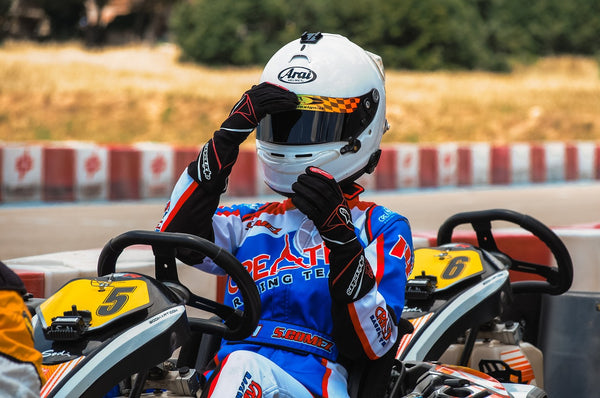 Kart Racing Driver Wearing a Arai Helmet - Fast Racer
