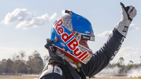 racing driver wearing carbon fiber racing helmet