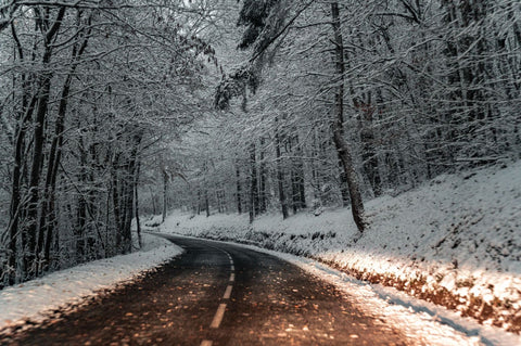 an empty road in winter season