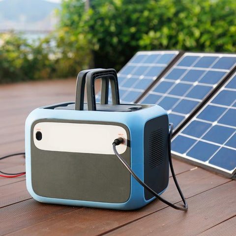 Bluetti - AC50S 500Wh/300W Portable Power Station charged in a solar panel.