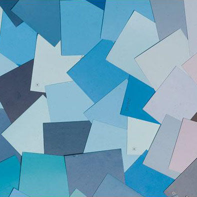 image of multiple blue paint color chips laid out on top of one another