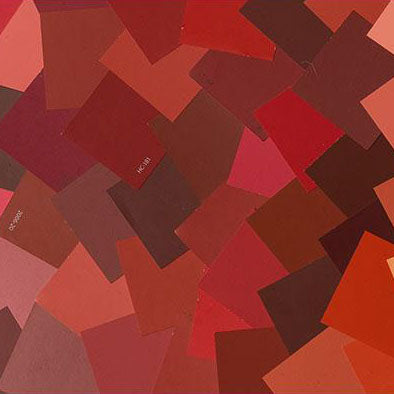 image of multiple red paint color chips laid out on top of one another