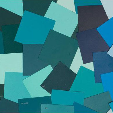 image of multiple teal paint color chips laid out on top of one another