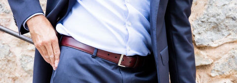 Man In A Suit With A Burgundy Belt