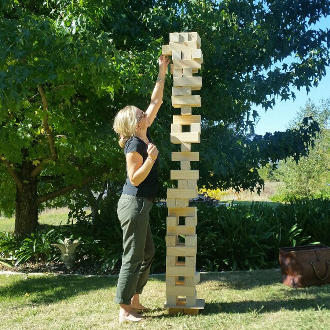 kids playing giant jenga game back yard