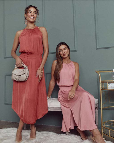 two women models posing in SheBird's effortless one-and-done dress with built-in bra 