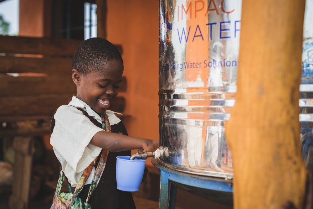 Kenyan School Child with Impact Water