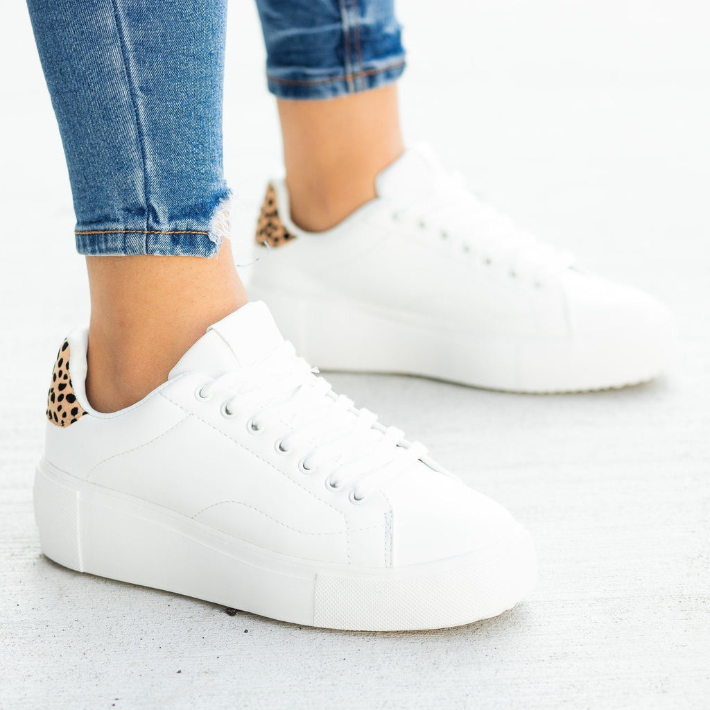 white sneakers with animal print