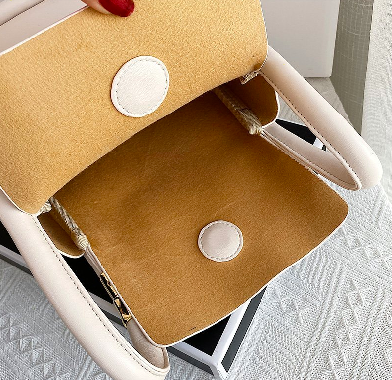 spacious handbag color beige small for women