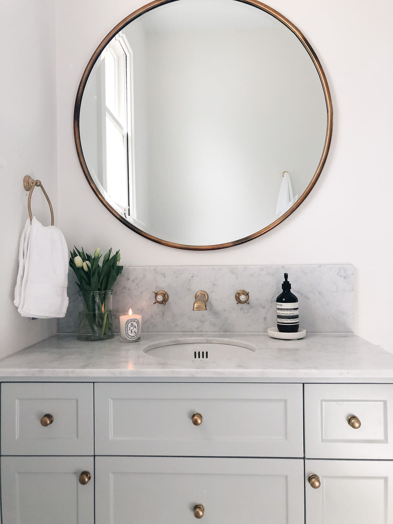 Bathroom Sink with Marble Top and Brass Hardware