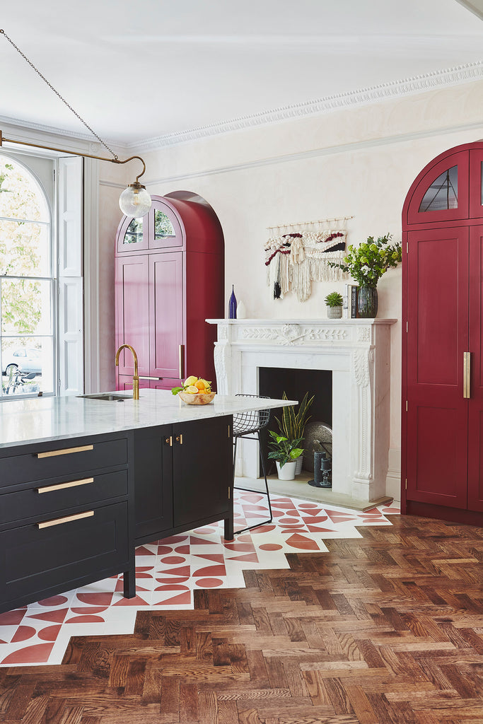 Kitchen with Black Island and Red Accents