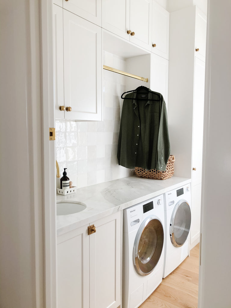 Neutral Utility Room with Brass Hardware