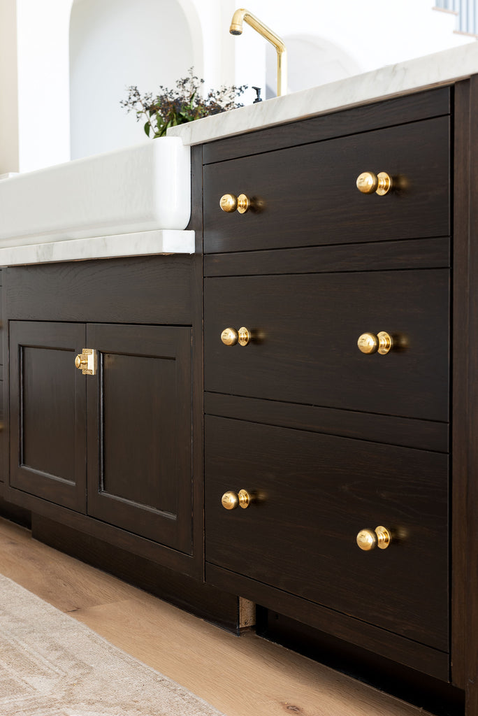 studio mcgee utility room cabinets polished brass hardware