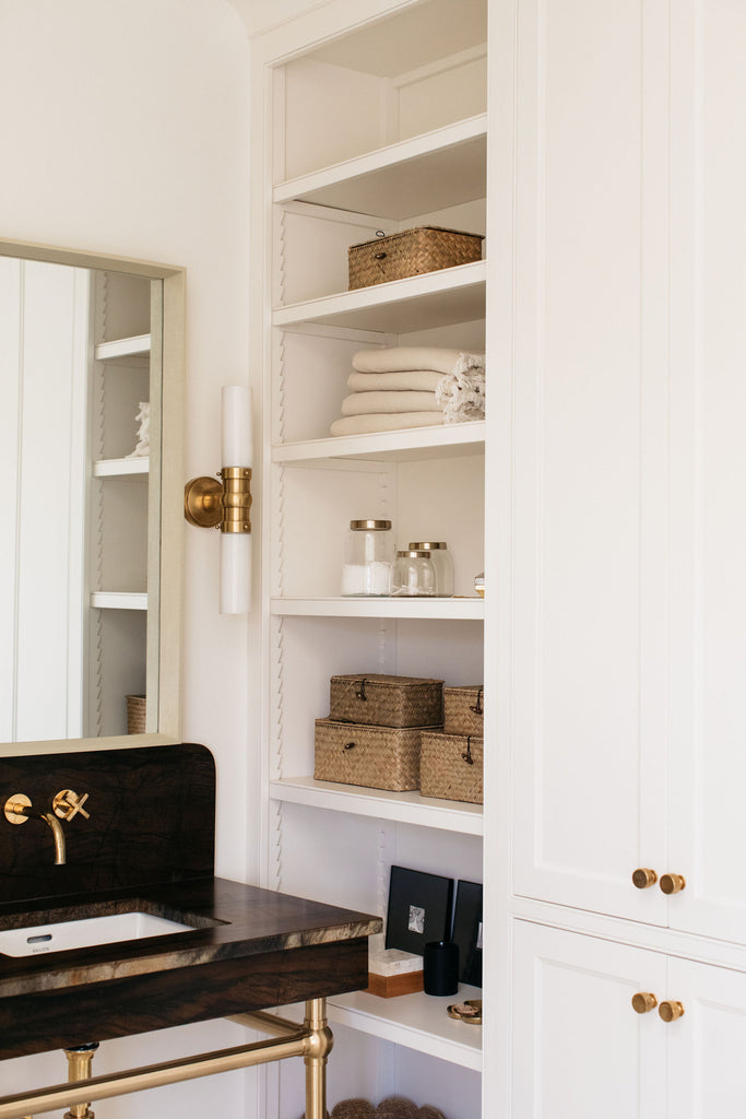 modern study shelves and cabinets with polished brass hardware