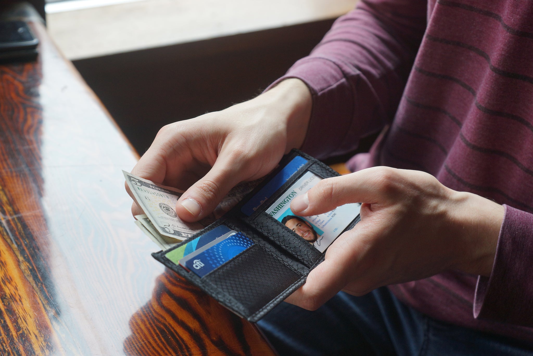 Common Fibers MAX 3.0 carbon fiber bifold wallet in use