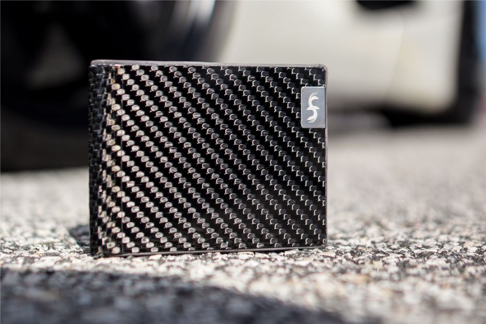 Common Fibers LMX Carbon Fiber Leather Bifold Wallet with Car Background