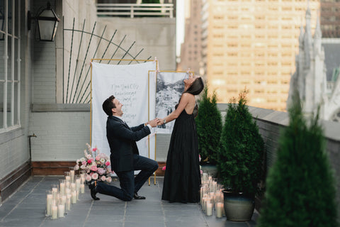 rooftop proposal with ring box sock to hide the engagement ring