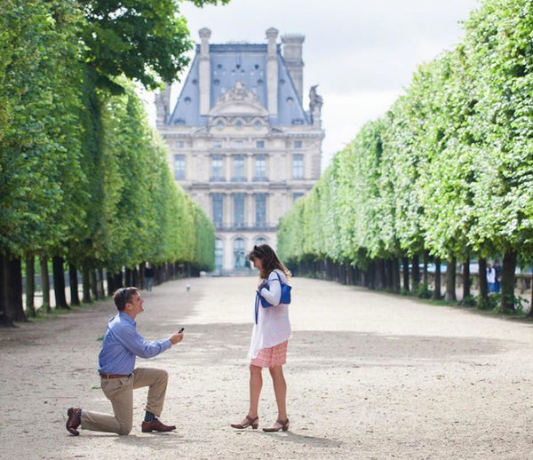 french garden proposal with man proposing to woman wearing proposal socks