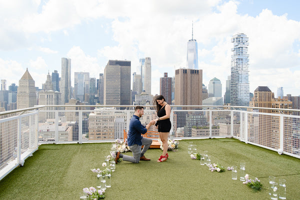 rooftop proposal in nyc wearing box sock