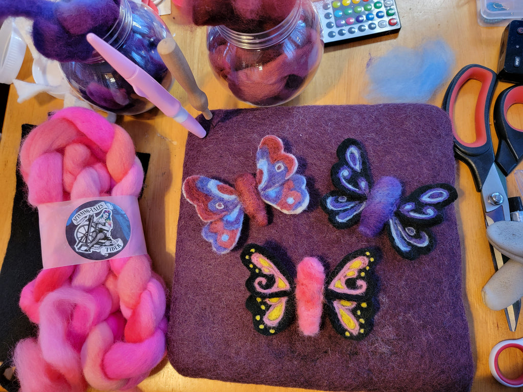 Three needle felted butterflies and pink wool