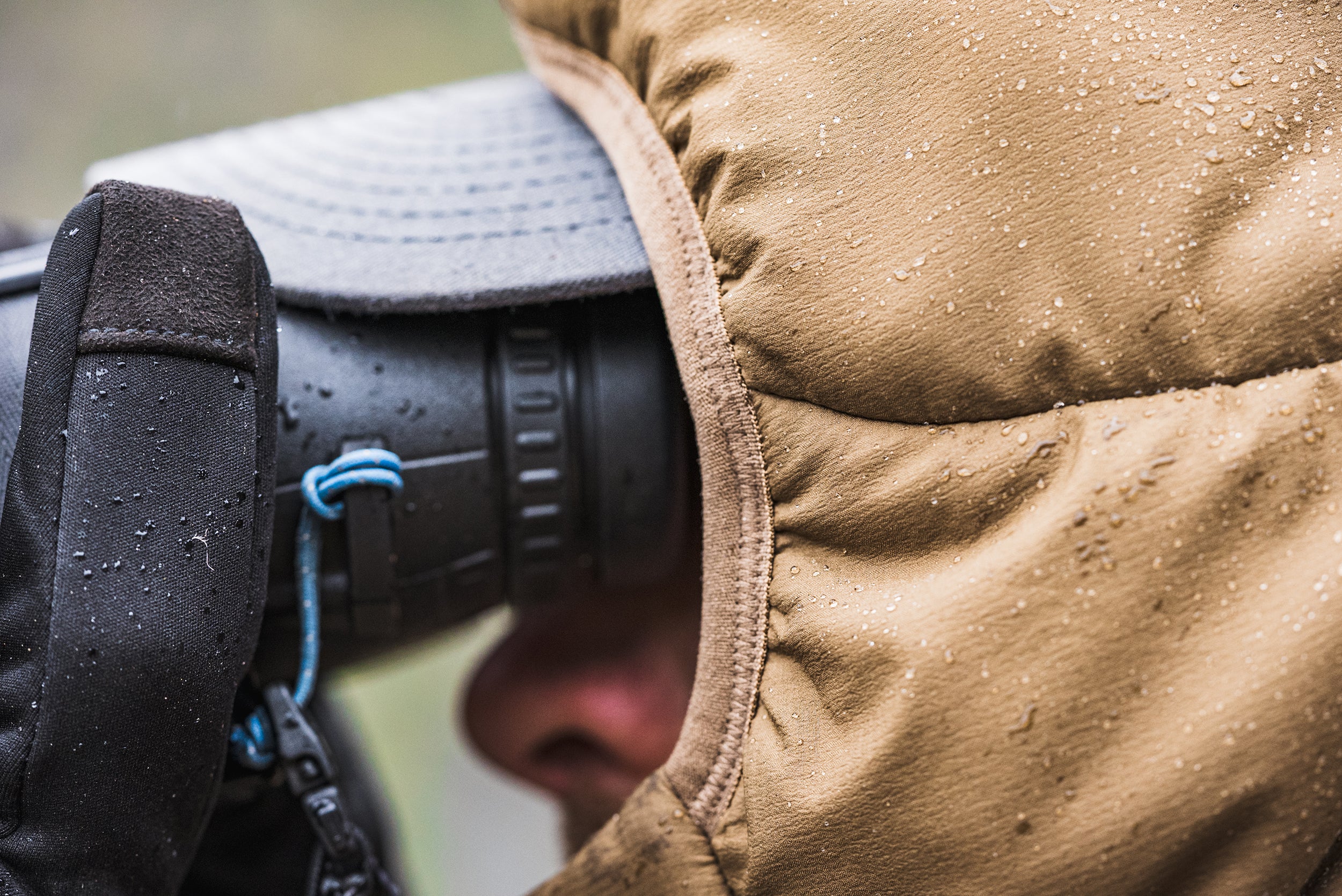 Hunter glassing with synthetic insulation jacket repelling rain