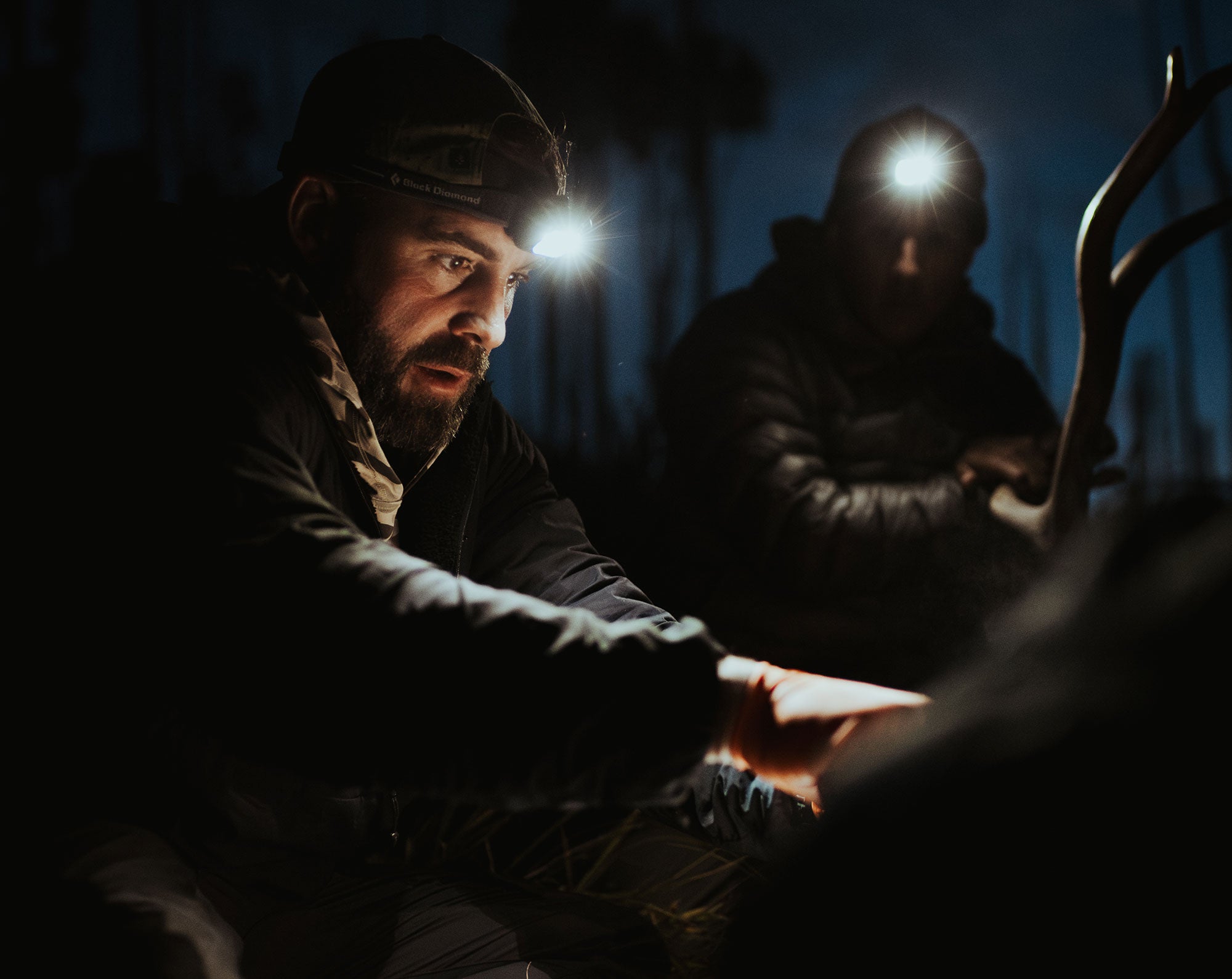 GOHUNT Founder Lorenzo Sartini breaks down an elk at night in New Mexico. Photo by Cam Henderson.