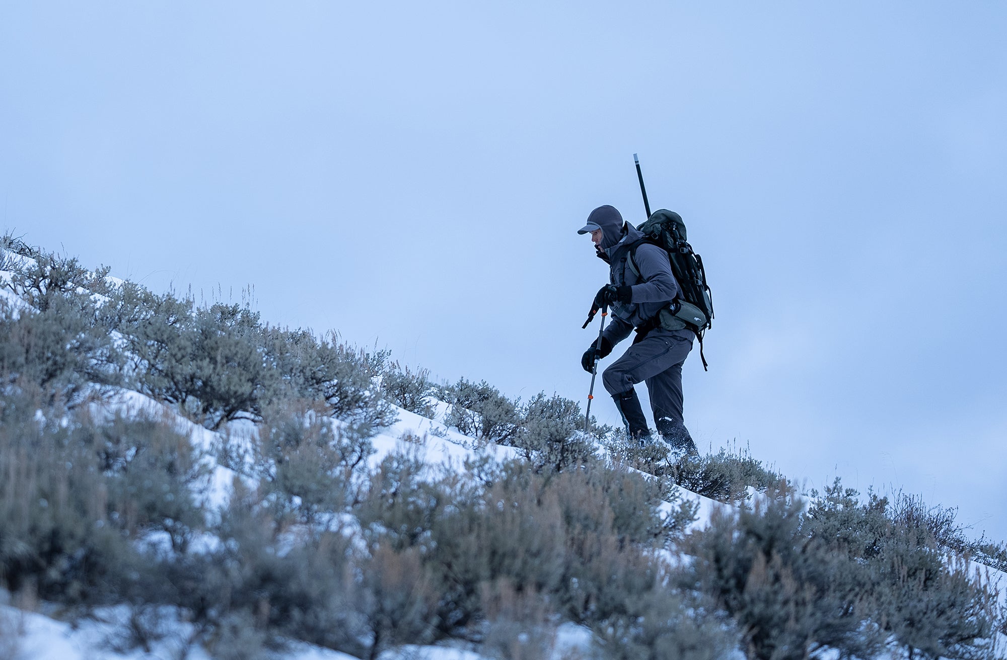 Hunter hiking in snow.