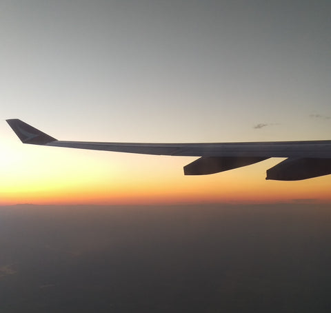 Sunset with airplane wing