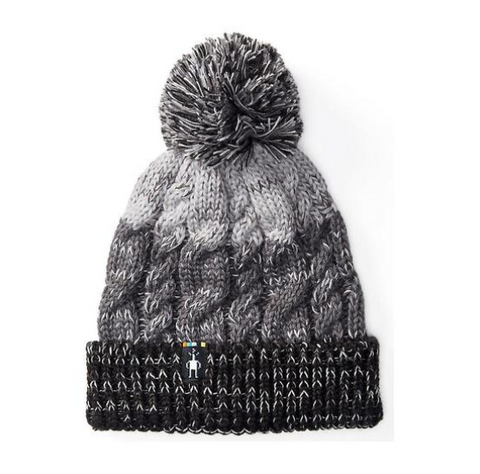 black and gray beanie with a pompom on top