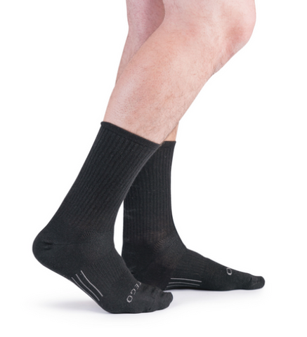 legs with black crew length socks on