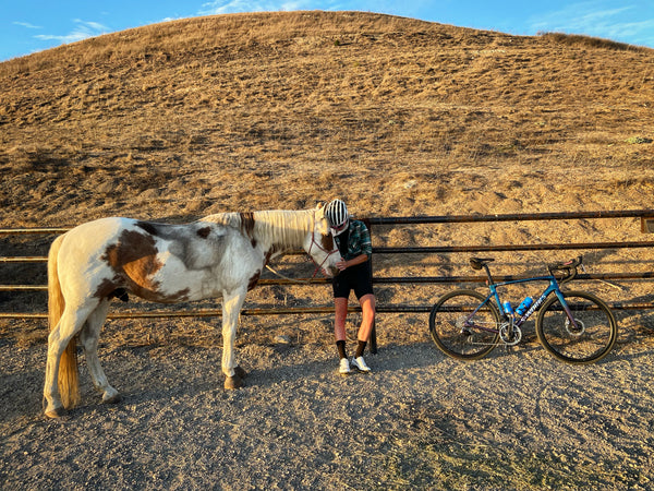 Alison with a horse and her bike