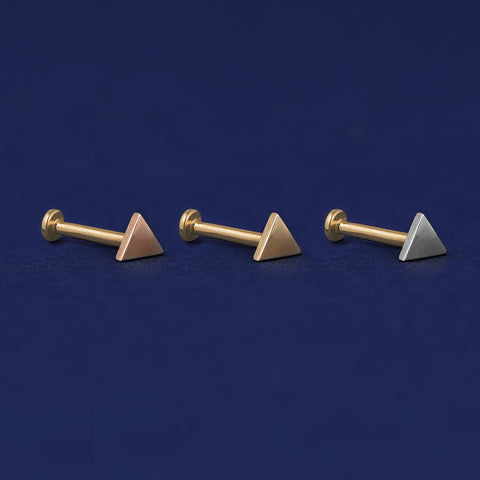 Three versions of the Triangle Flat Back Earring shown in options of rose, yellow, and white gold