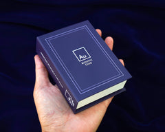 A dark blue and white Automic Gold book box closed