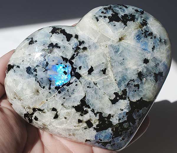 Moonstone can be purchased as raw stones or with a polished finish in sphere, heart, and tower shapes.