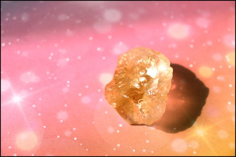 Citrine stone on a peach yellow background